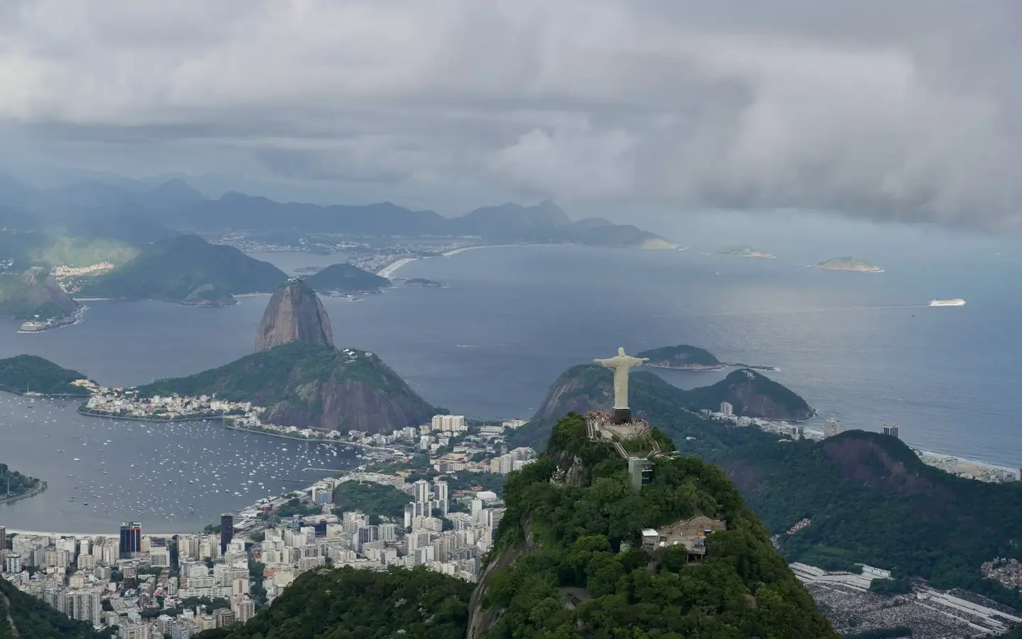 Aerial view of Christ the Redeemer and Sugarloaf Mountain overlooking Rio de Janeiro coastline, Brazil