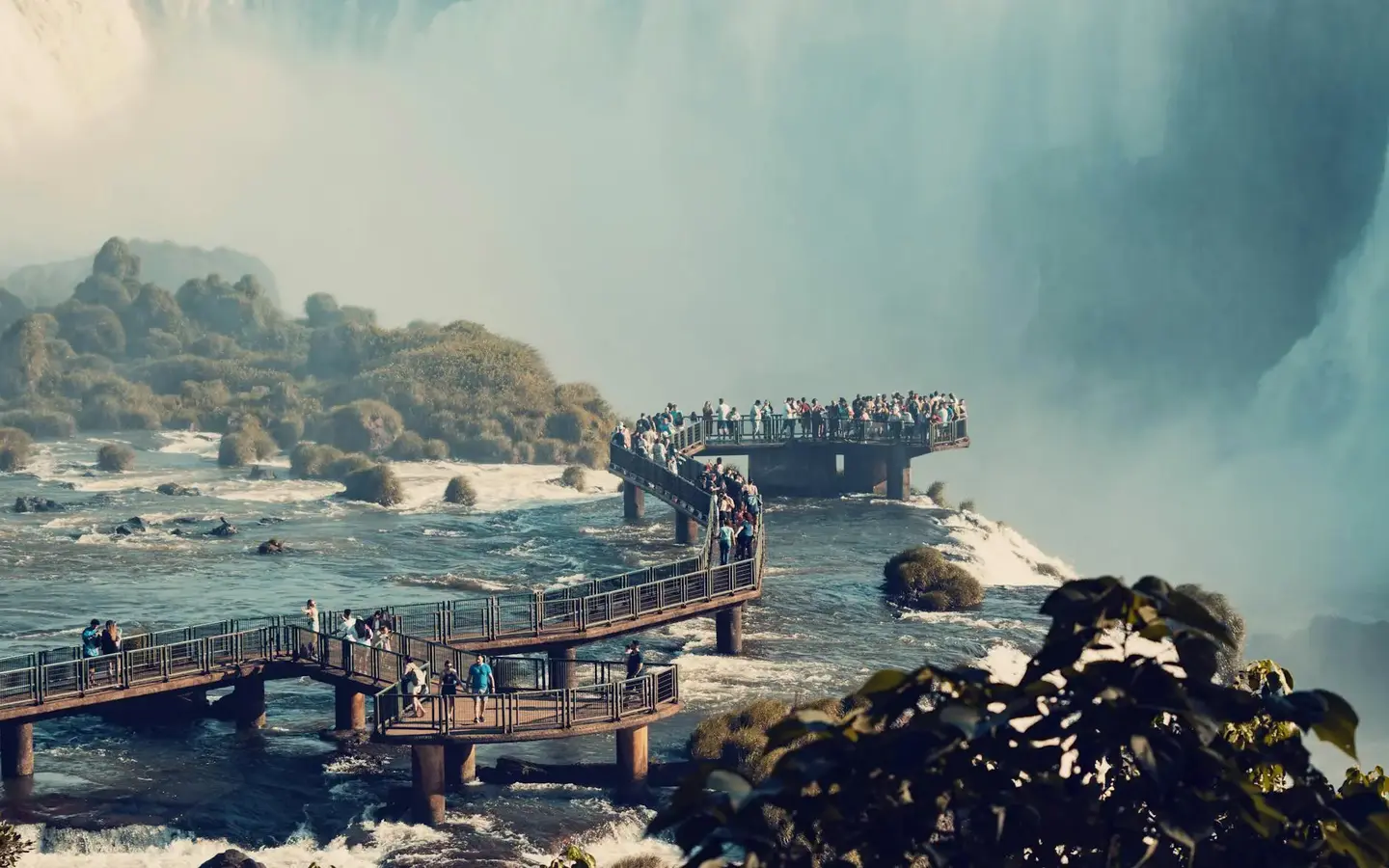 Iguazu Falls cascading through lush rainforest on the Brazil-Argentina border