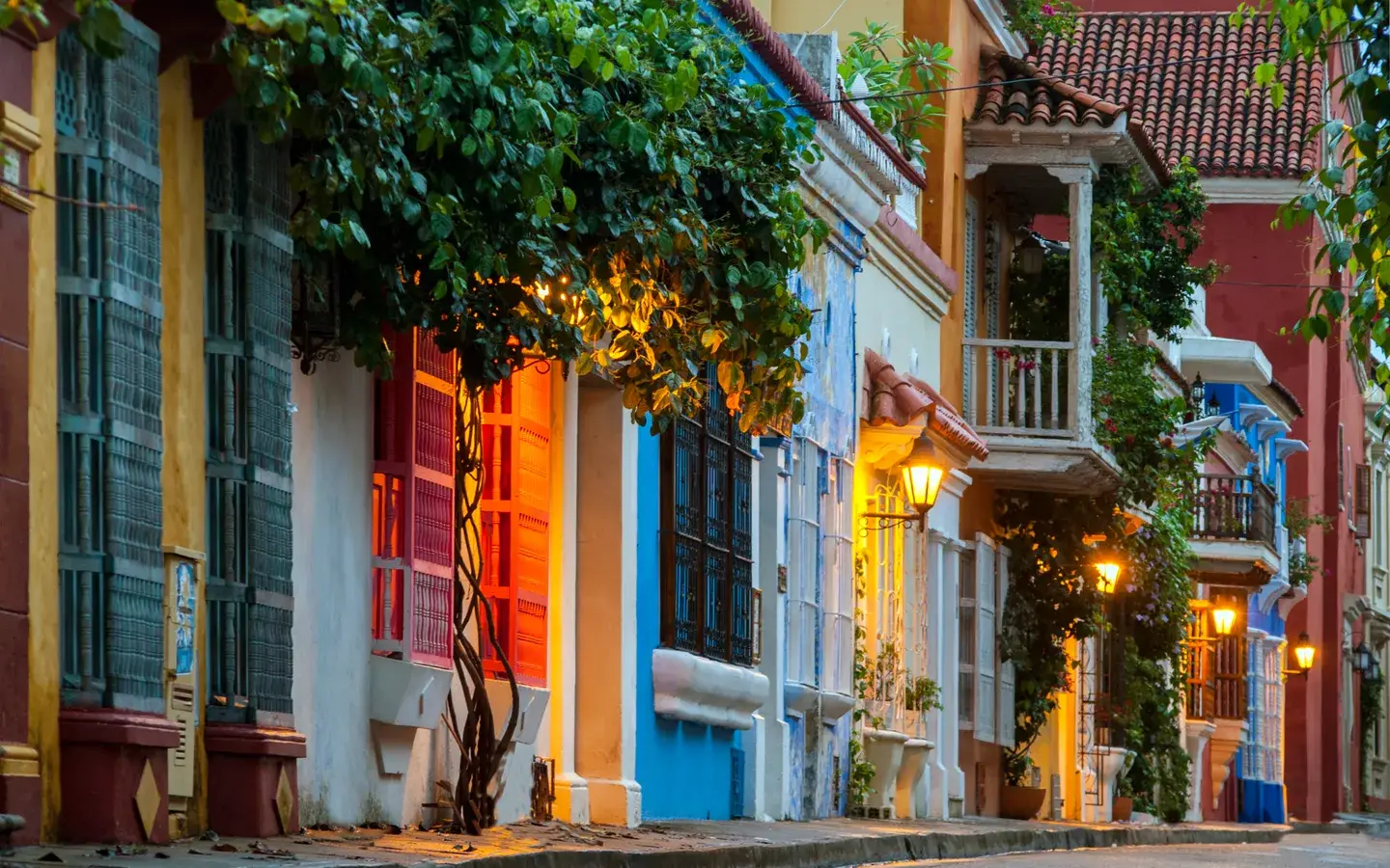 Colourful colonial houses with balconies and bougainvillea on a street in the old town of Cartagena, Colombia