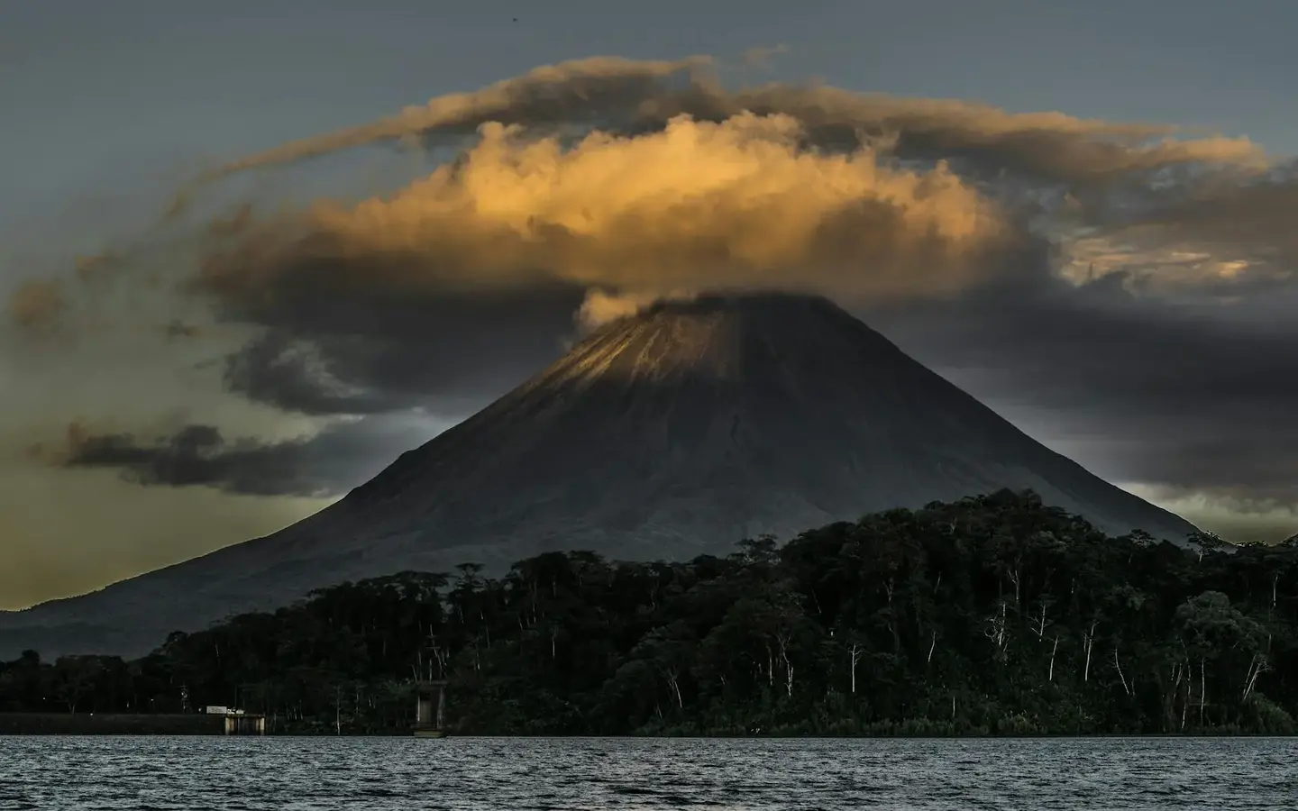 Arenal Volcano rising above the Costa Rican rainforest at dusk