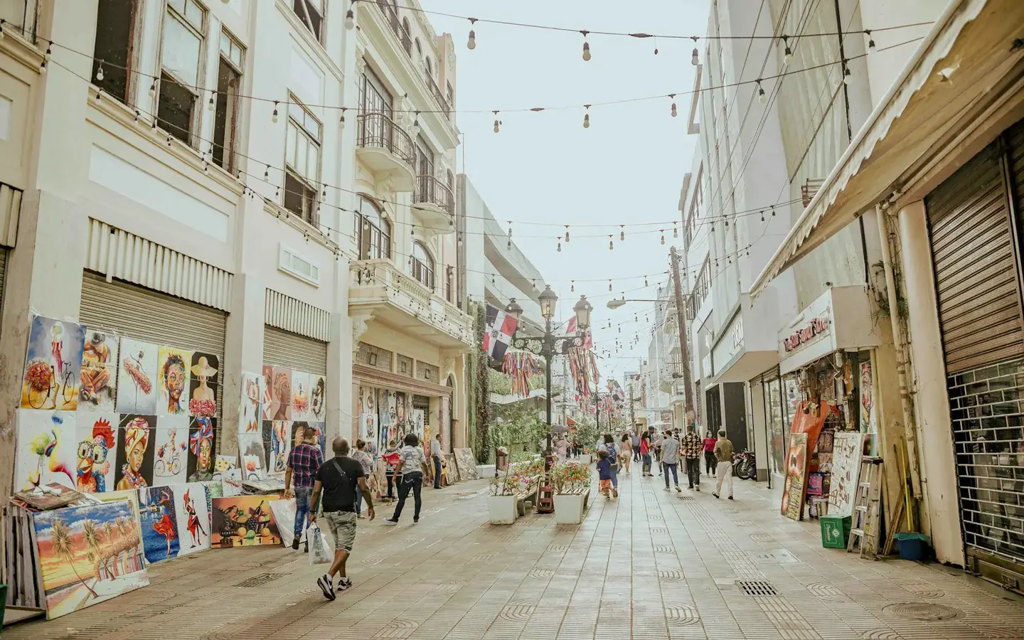 People walking through a colourful street in the Colonial Zone, Dominican Republic