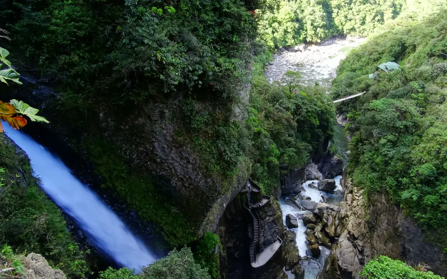The Pailón del Diablo waterfall crashing into a green gorge near Baños, Ecuador
