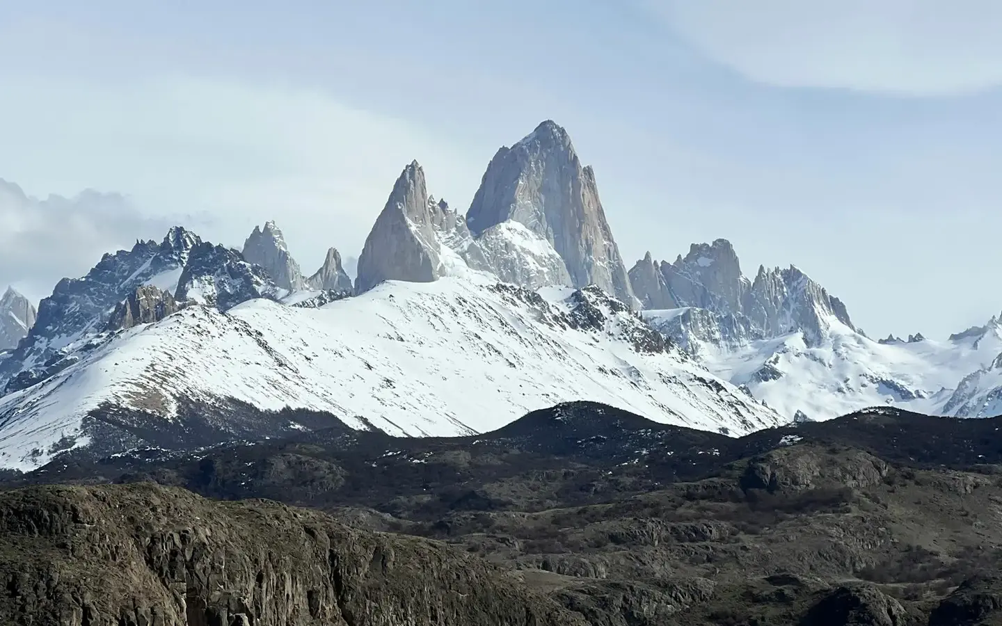 The dramatic snow-capped granite peaks of Mount Fitz Roy in Argentine Patagonia under a clear blue sky