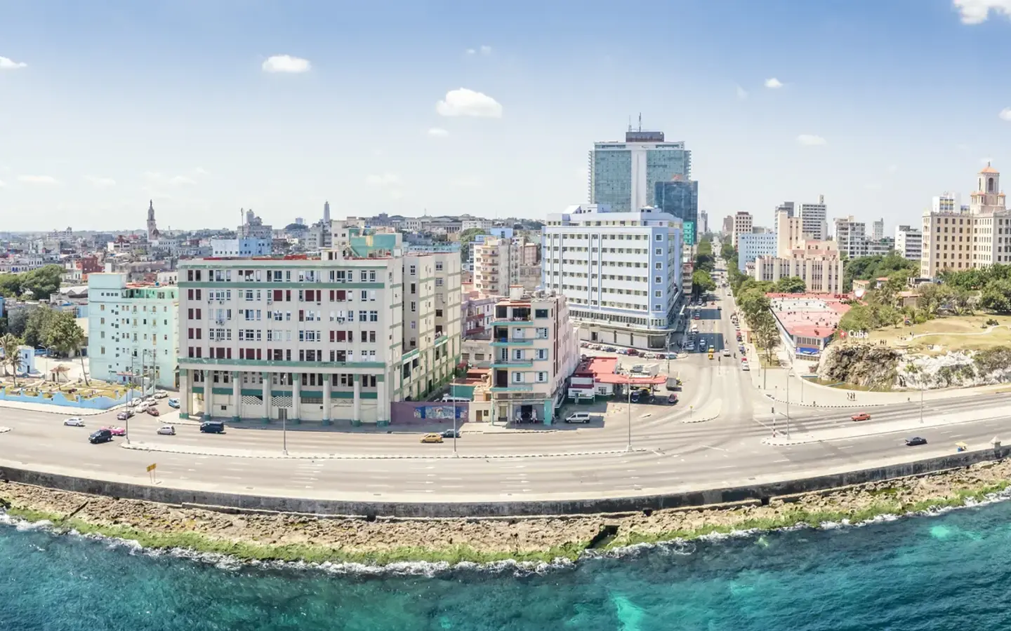 Aerial panoramic of the Malecón curve in Havana with Hotel Nacional in the distance, Cuba