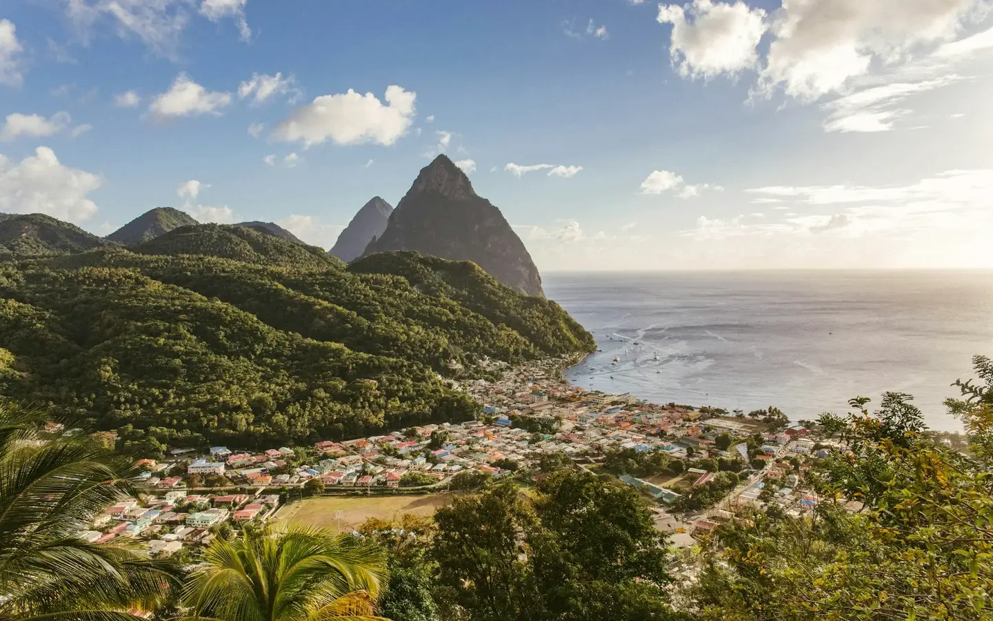 The twin Pitons rising above Soufriere and the Caribbean Sea in Saint Lucia