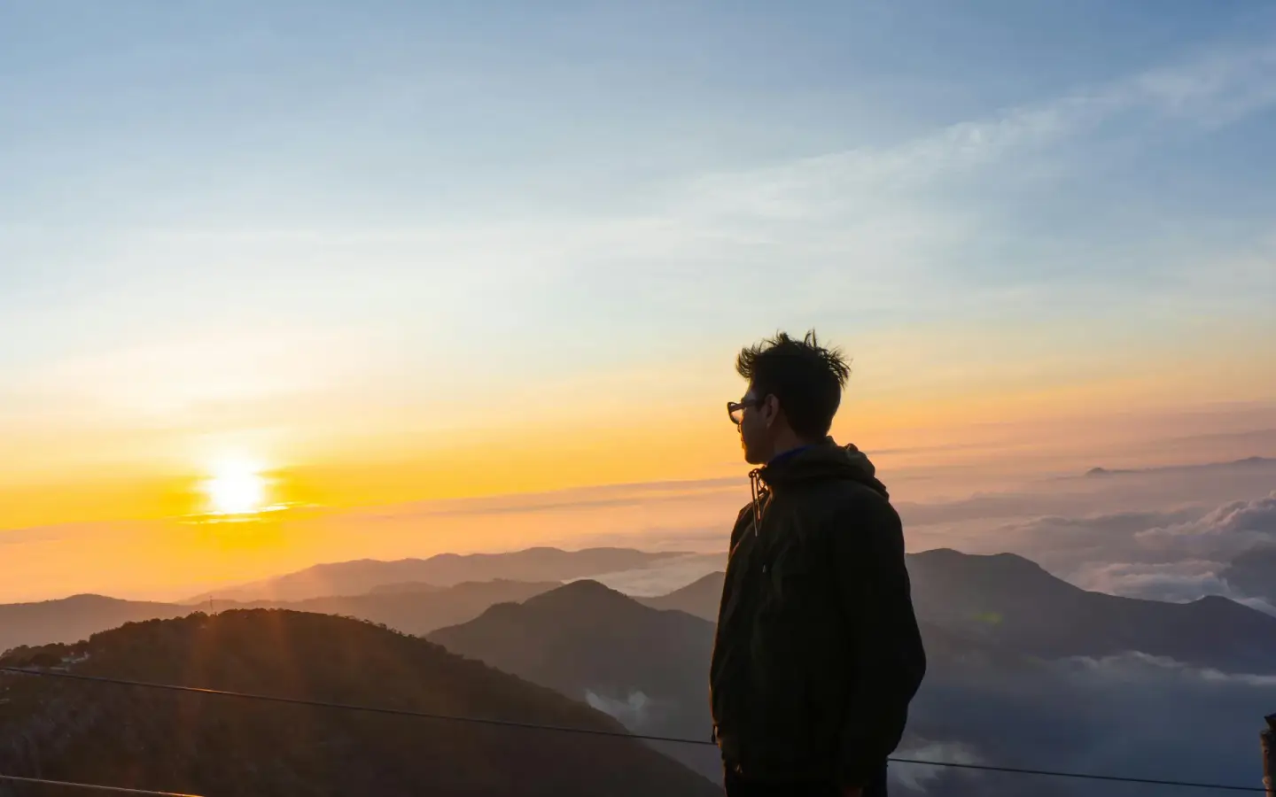 A lone traveller watching sunrise over the mountains of Mexico — a bespoke, tailor-made Latin America journey